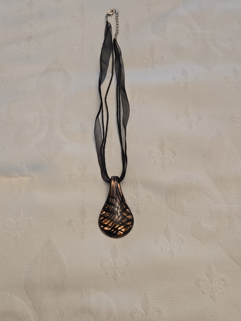 Elegant Black Ribbon Necklace with Gold Teardrop Pendant